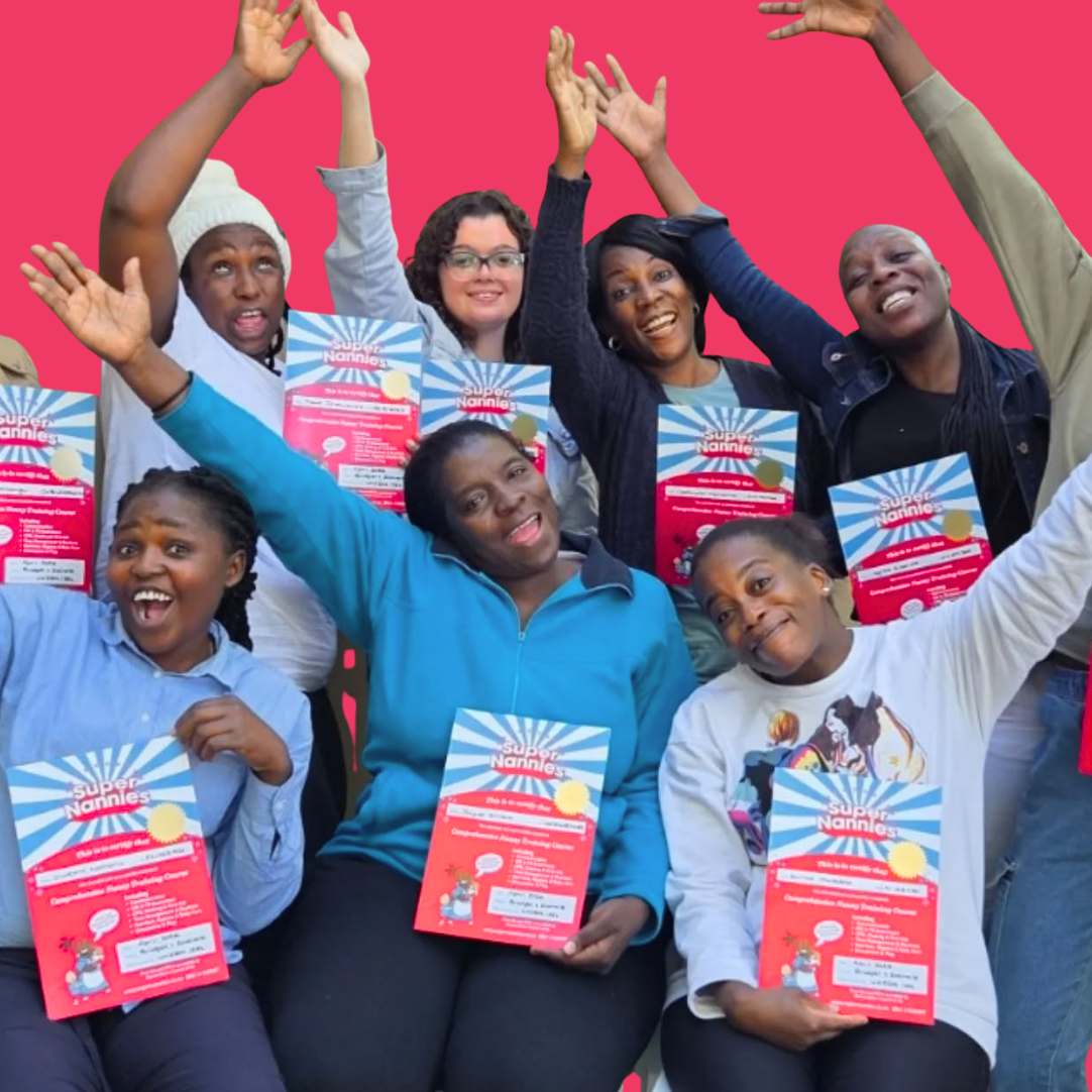 A group of smiling nannies celebrating their Super Nannies training certificates