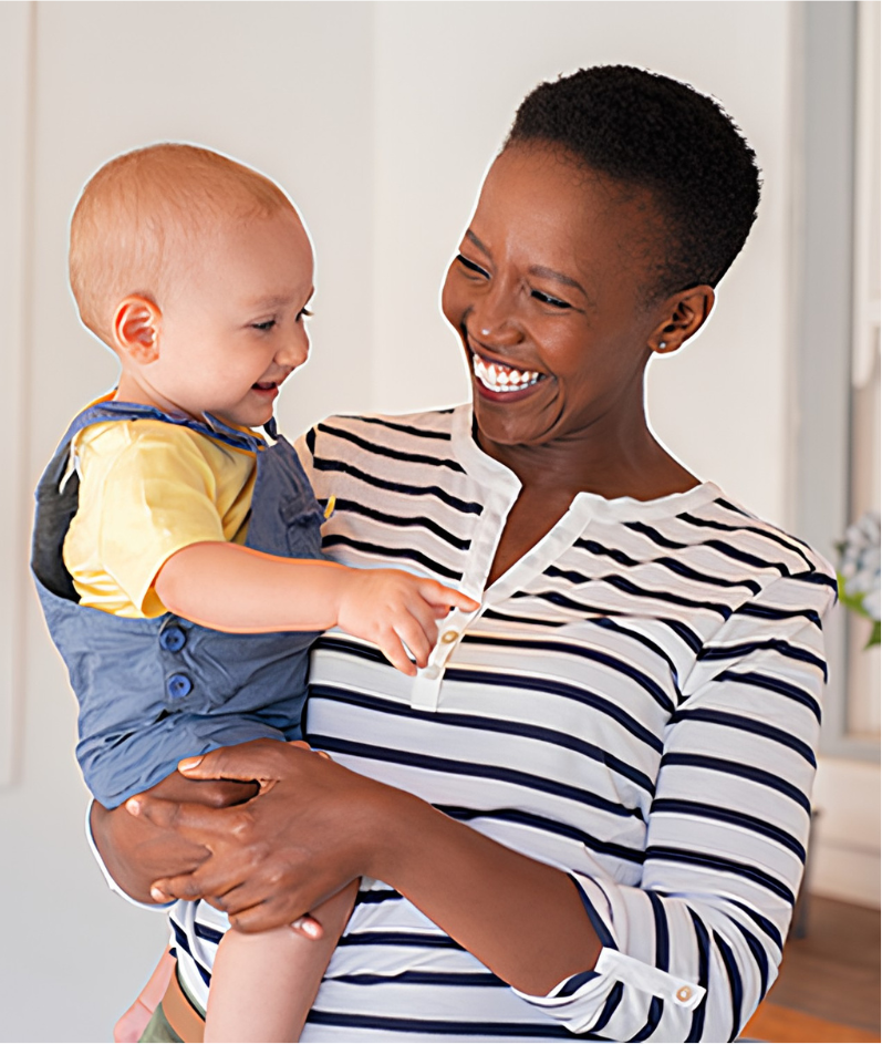 A smiling woman holding a laughing baby